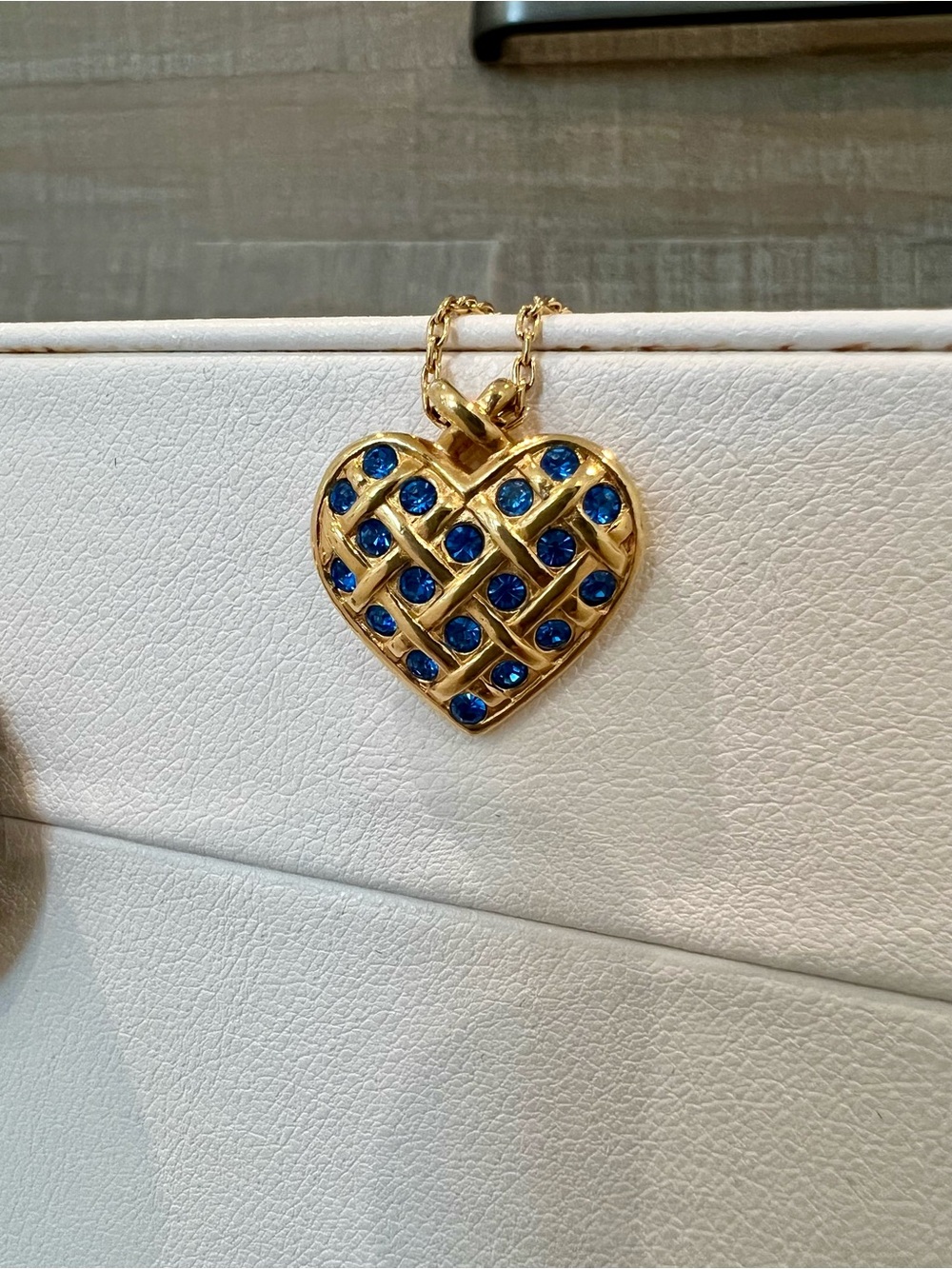 Vintage Avon gold tone heart with blue crystal accents